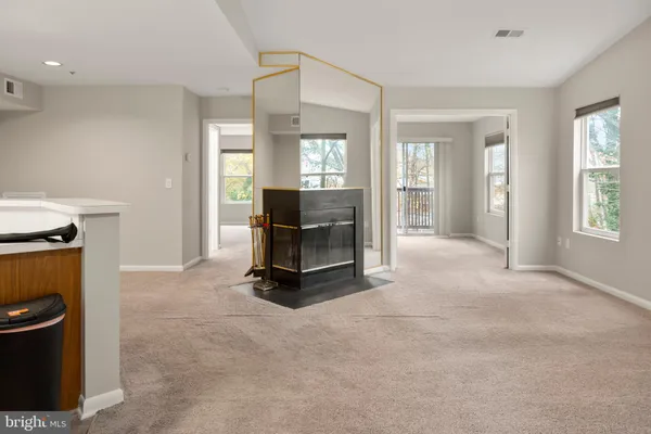 a view of a livingroom with furniture and a window