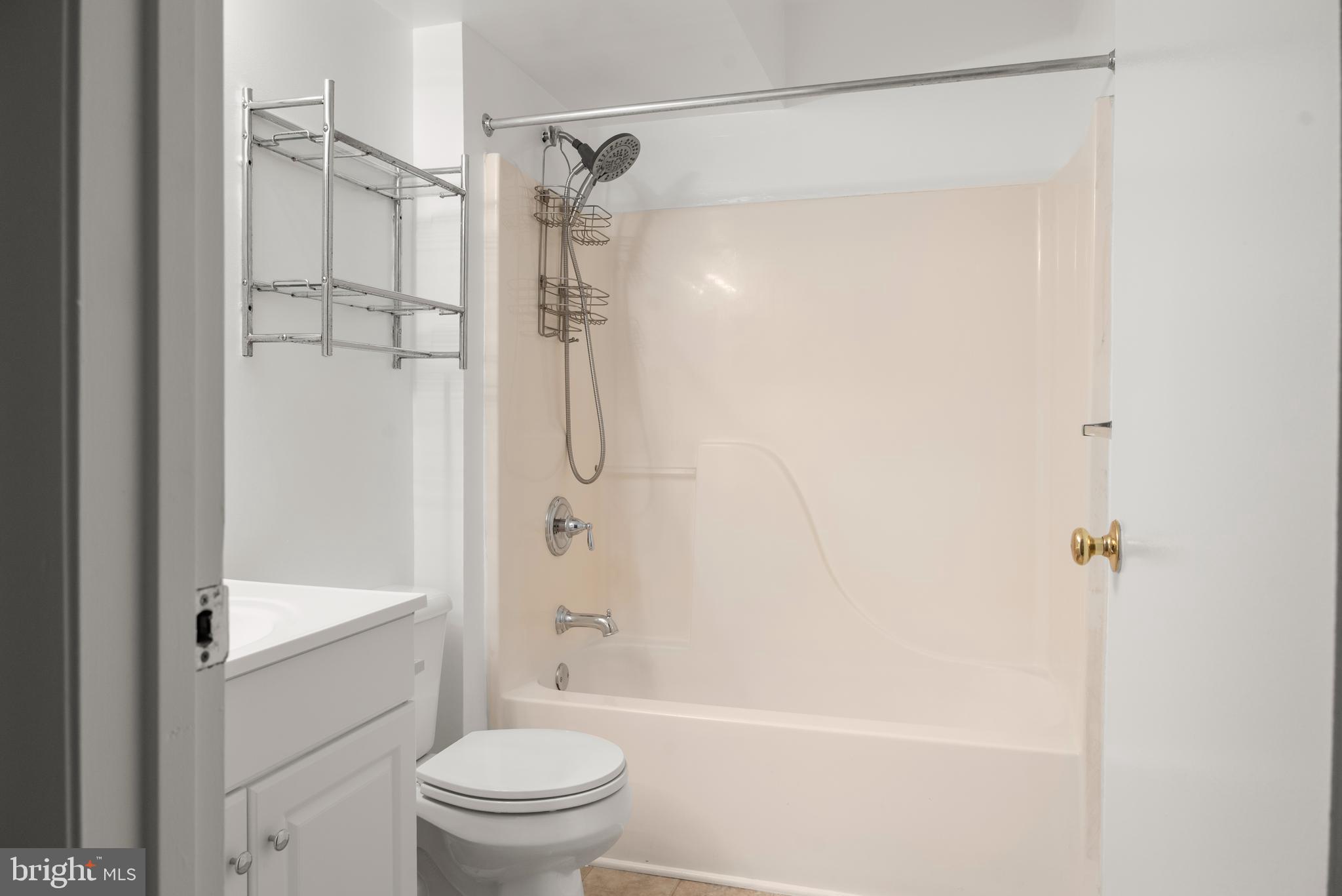 10 L Amberstone Court, Unit L Annapolis, MD 21403 - Photo 18 of 25 a bathroom with a shower and a toilet