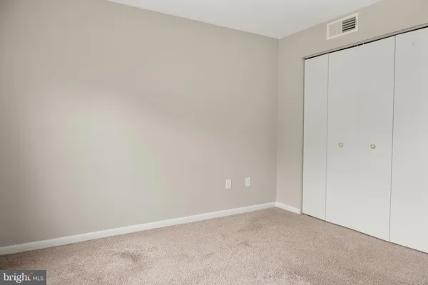 a view of a porch with wooden floor and fence