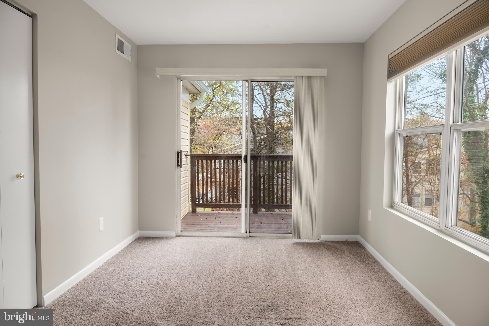 10 L Amberstone Court, Unit L Annapolis, MD 21403 - Photo 24 of 25 an empty room with windows
