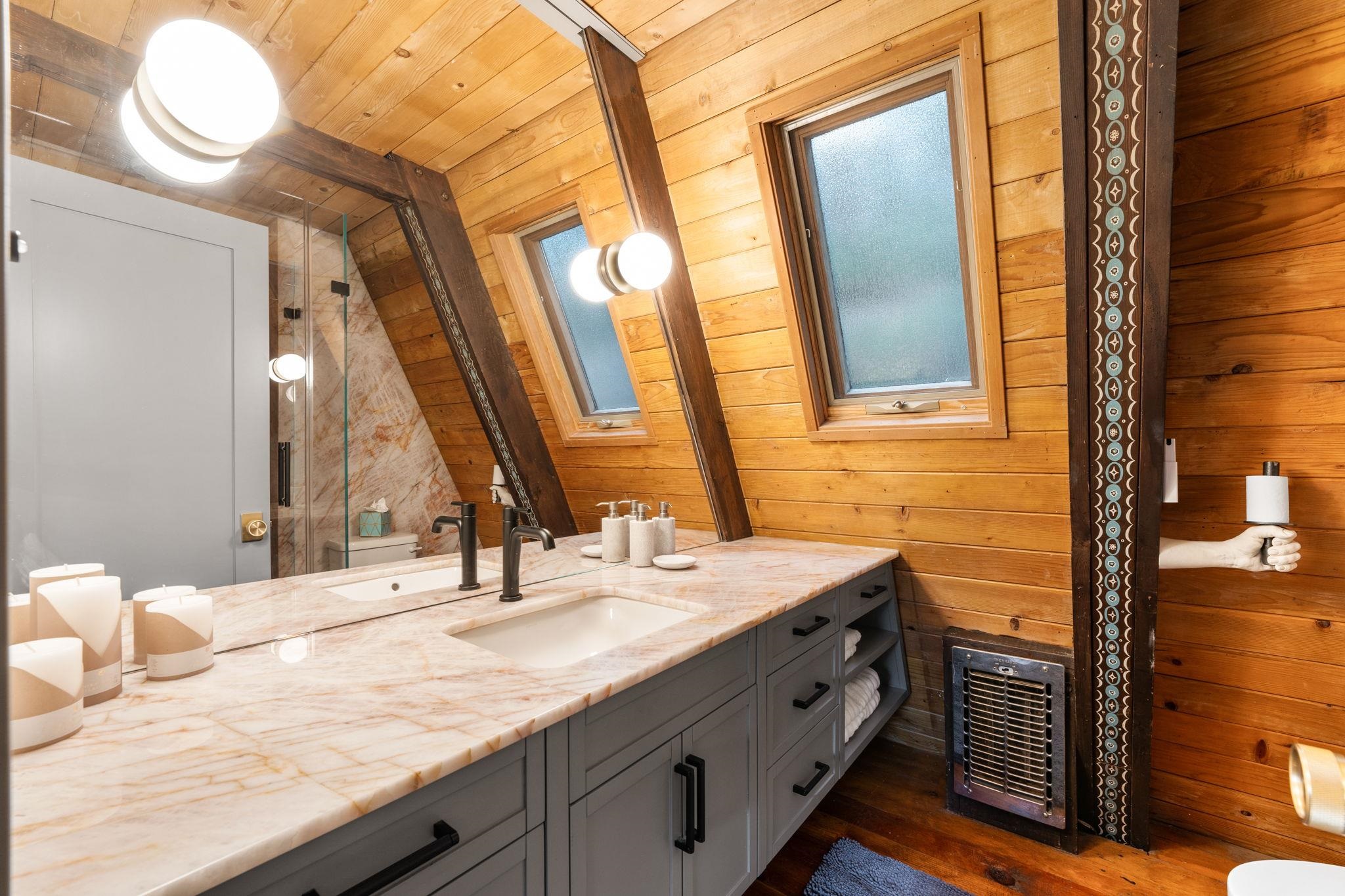 4285 Jeffrey Way Carnelian Bay, CA 96140 - Photo 11 of 21 a bathroom with a sink double vanity and a mirror