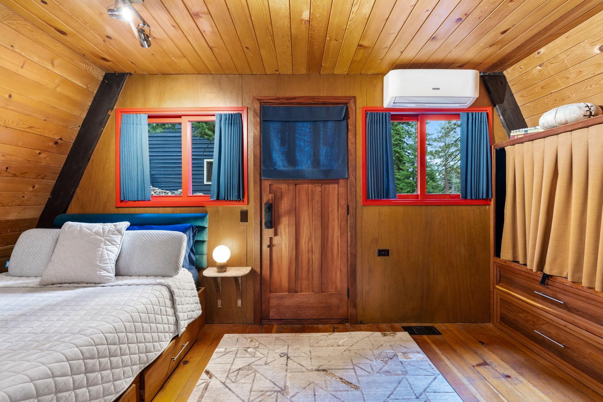 4285 Jeffrey Way Carnelian Bay, CA 96140 - Photo 14 of 21 a bedroom with a bed and a window