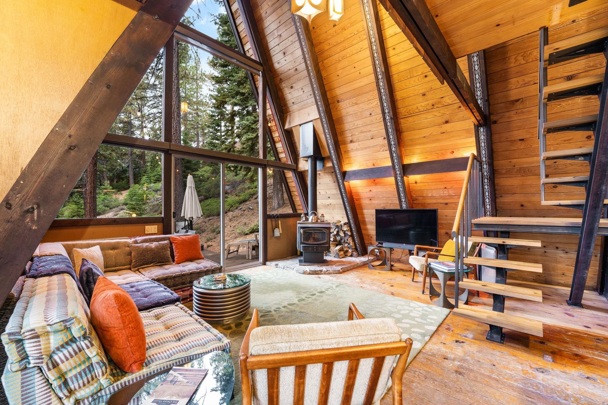 4285 Jeffrey Way Carnelian Bay, CA 96140 - Photo 5 of 21 a outdoor space with patio the couches and a dining table and chairs with wooden floor