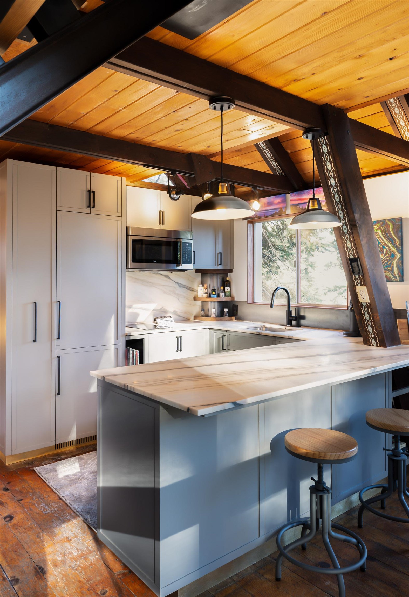 4285 Jeffrey Way Carnelian Bay, CA 96140 - Photo 9 of 21 a kitchen with stainless steel appliances kitchen island a table and chairs in it