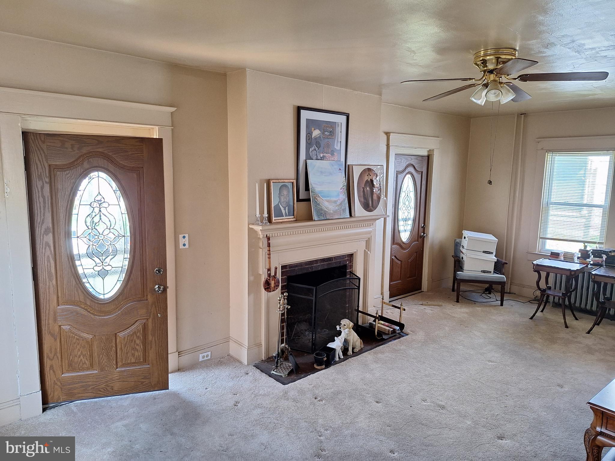 3803 Cedardale Road Baltimore, MD 21215 - Photo 15 of 56 a living room with furniture and a fireplace