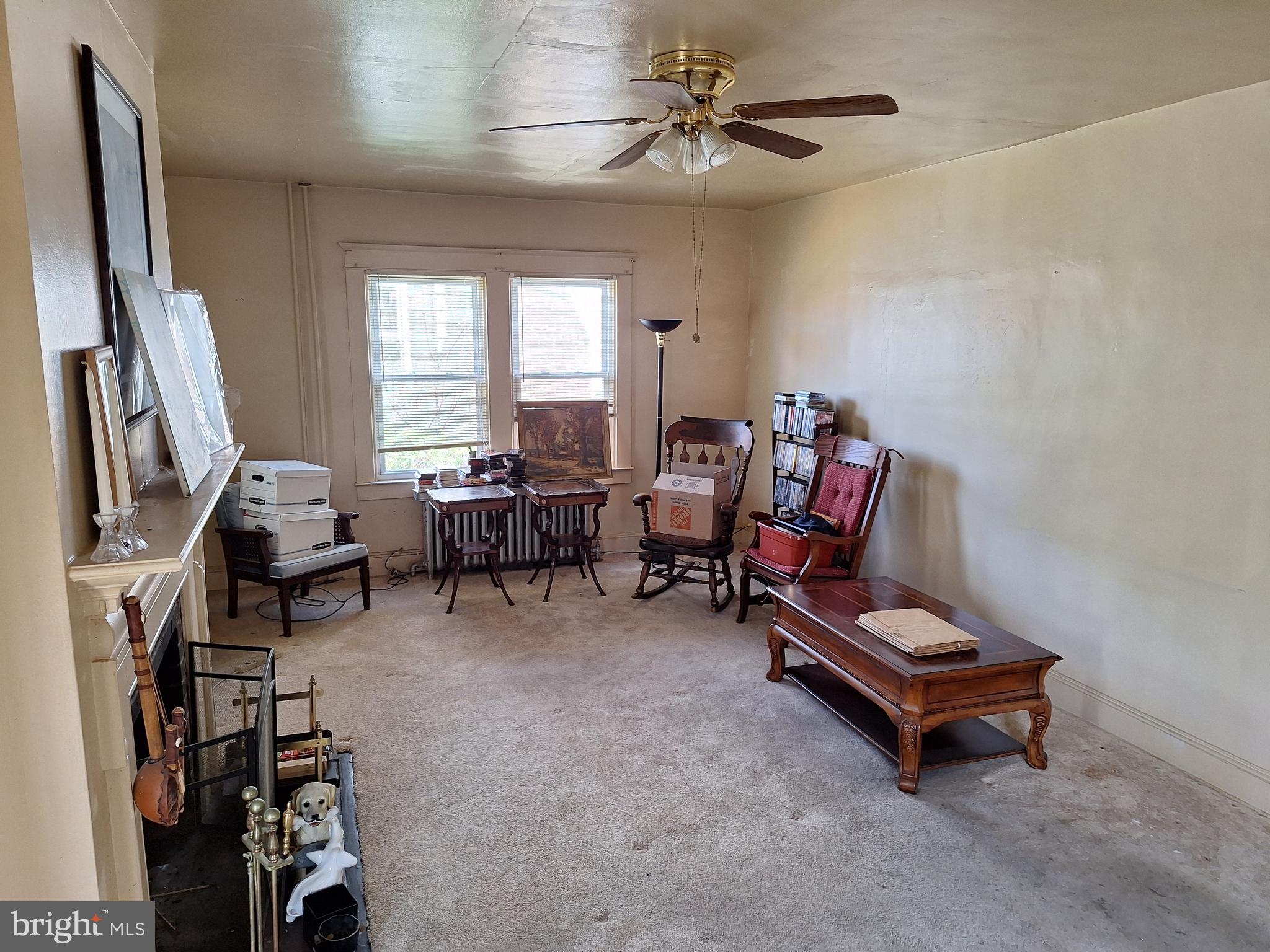 3803 Cedardale Road Baltimore, MD 21215 - Photo 17 of 56 a living room with furniture gym equipment and a flat screen tv