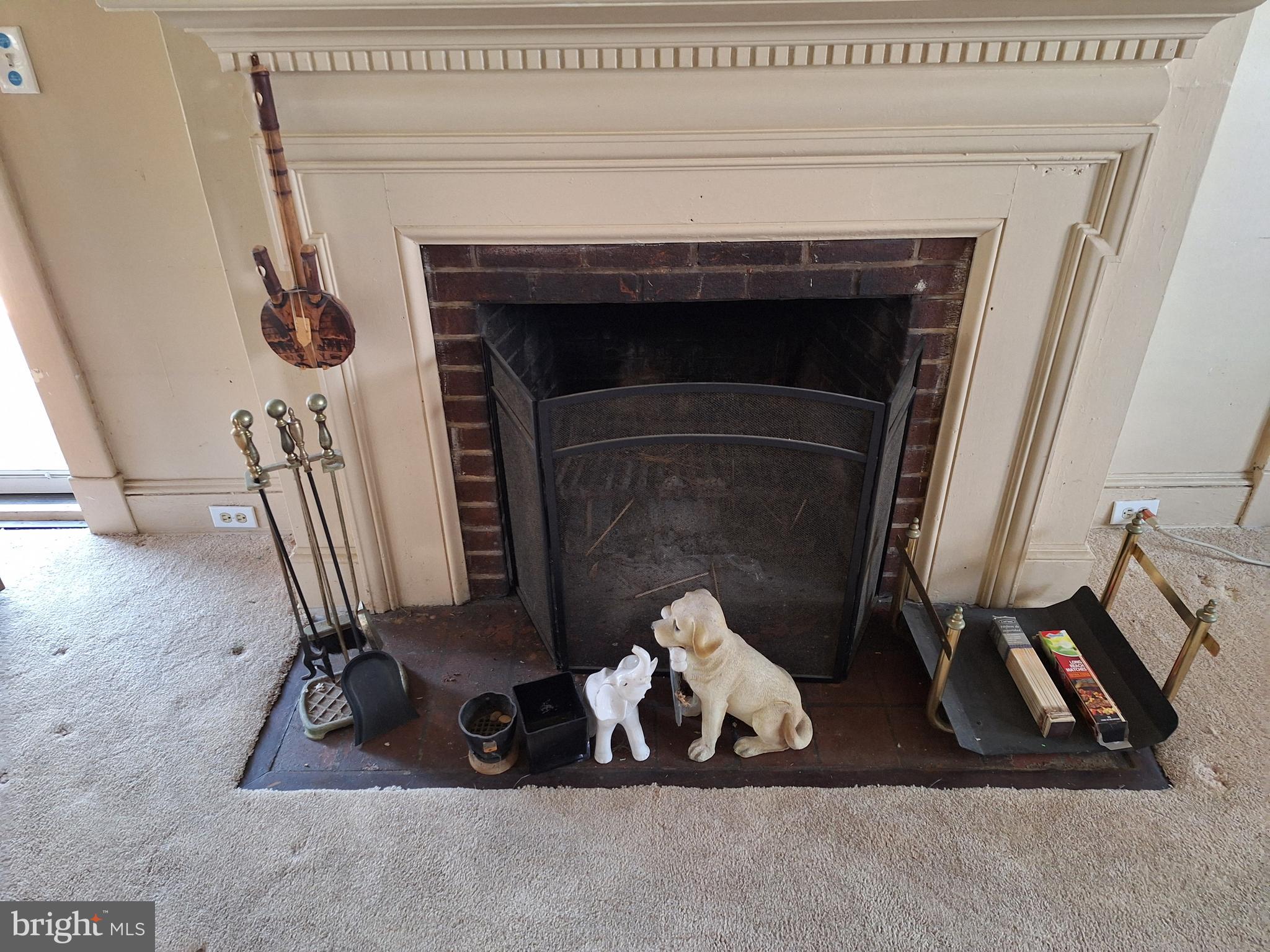 3803 Cedardale Road Baltimore, MD 21215 - Photo 18 of 56 a living room with a fireplace