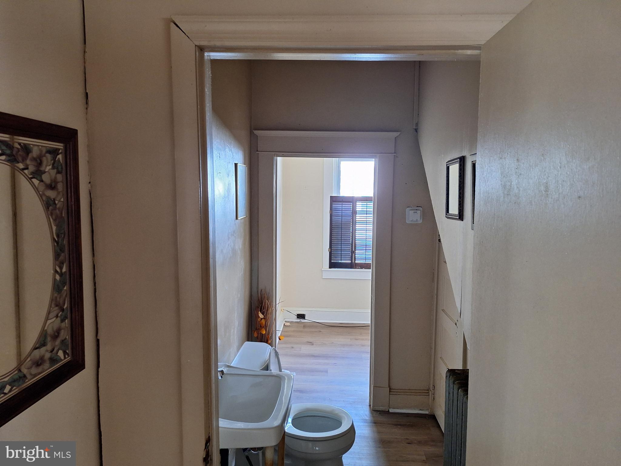 3803 Cedardale Road Baltimore, MD 21215 - Photo 20 of 56 a bathroom with a toilet and a mirror