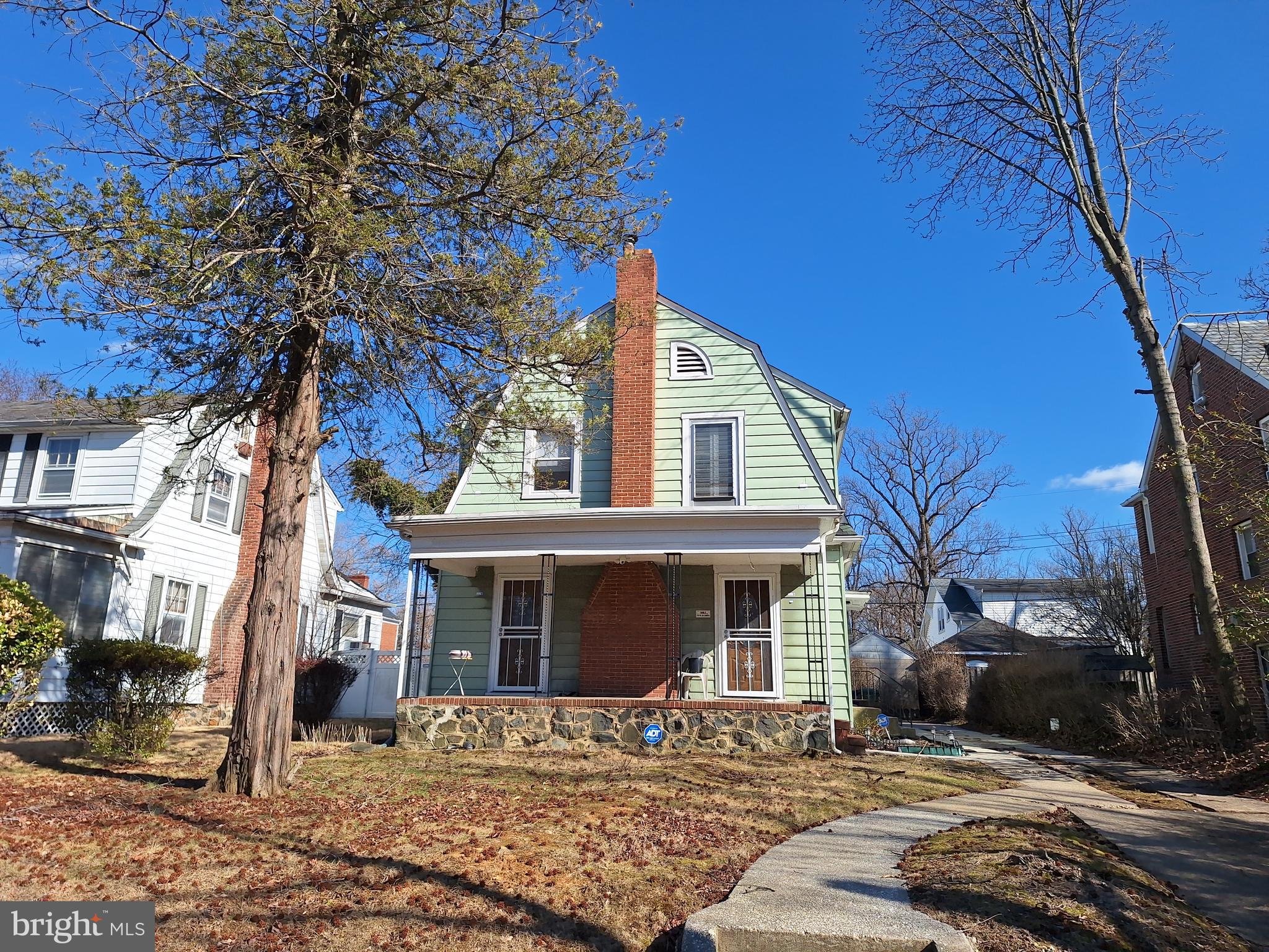 3803 Cedardale Road Baltimore, MD 21215 - Photo 2 of 56 a front view of a house with a yard