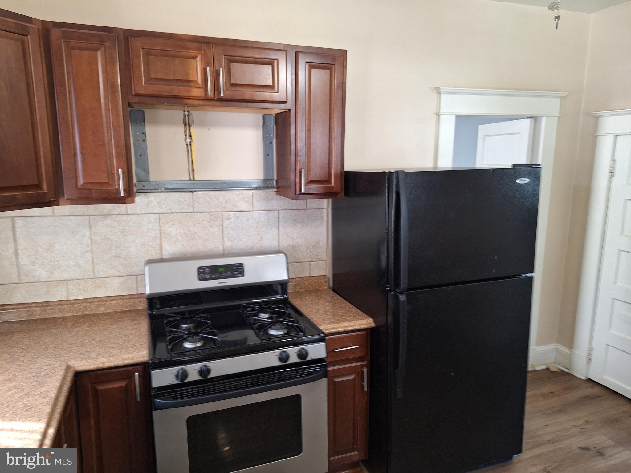 3803 Cedardale Road Baltimore, MD 21215 - Photo 27 of 56 a kitchen with appliances and cabinets