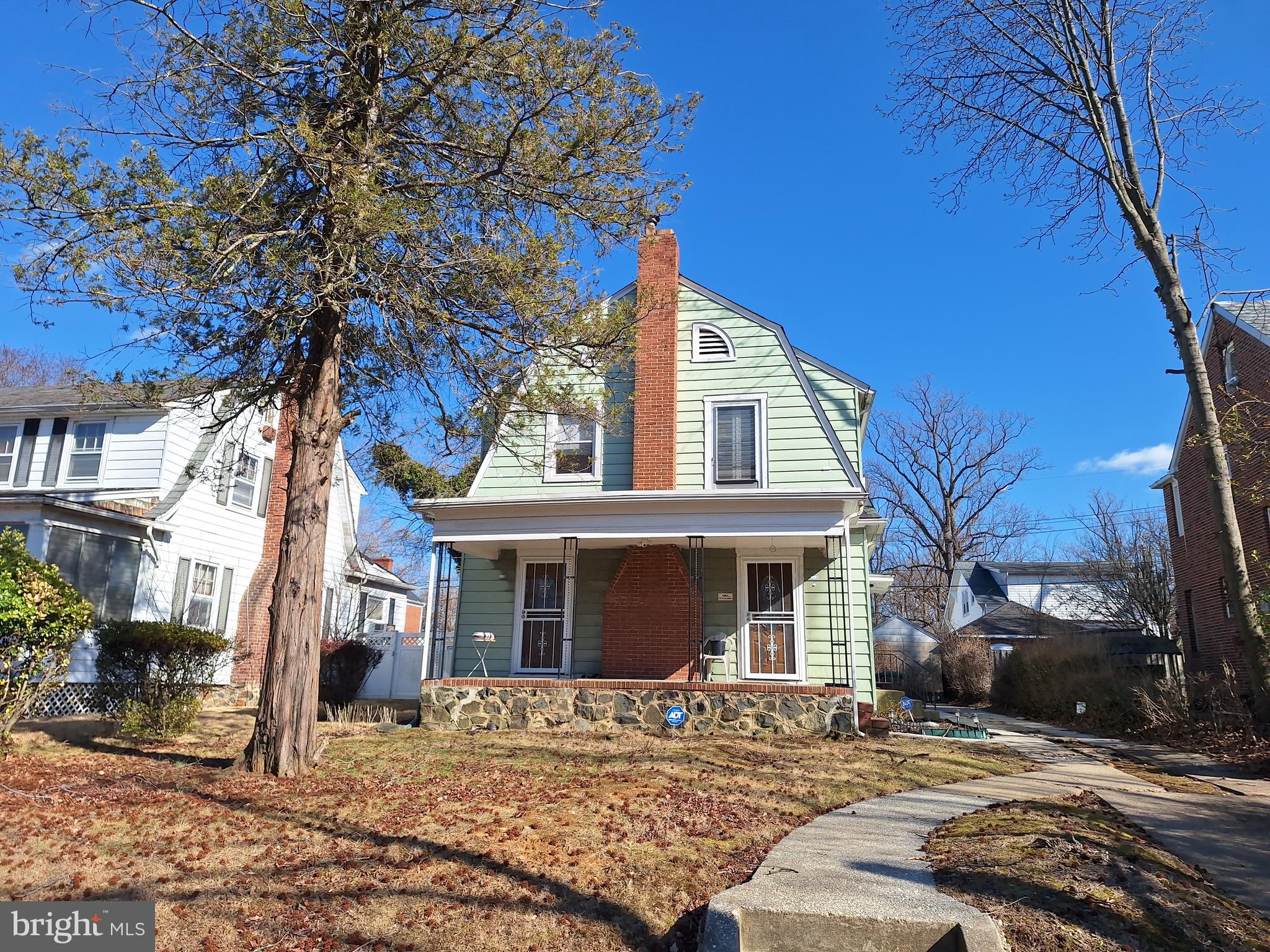 3803 Cedardale Road Baltimore, MD 21215 - Photo 3 of 56 a front view of a house with a tree
