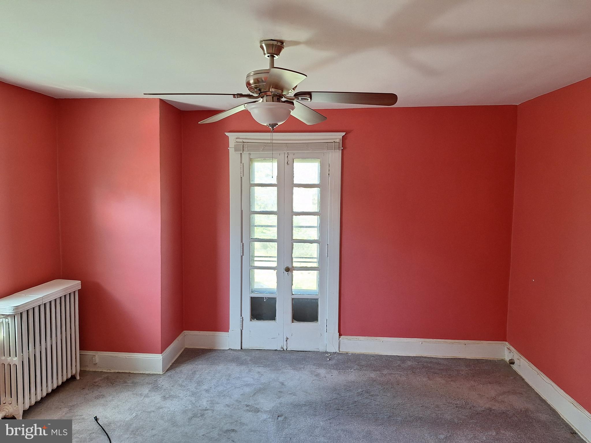 3803 Cedardale Road Baltimore, MD 21215 - Photo 35 of 56 an empty room with windows
