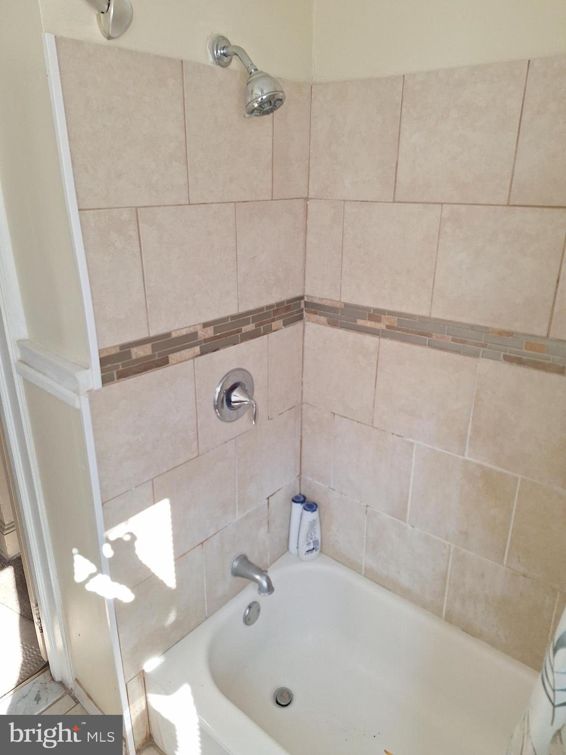 3803 Cedardale Road Baltimore, MD 21215 - Photo 40 of 56 a bathroom with a sink and shower