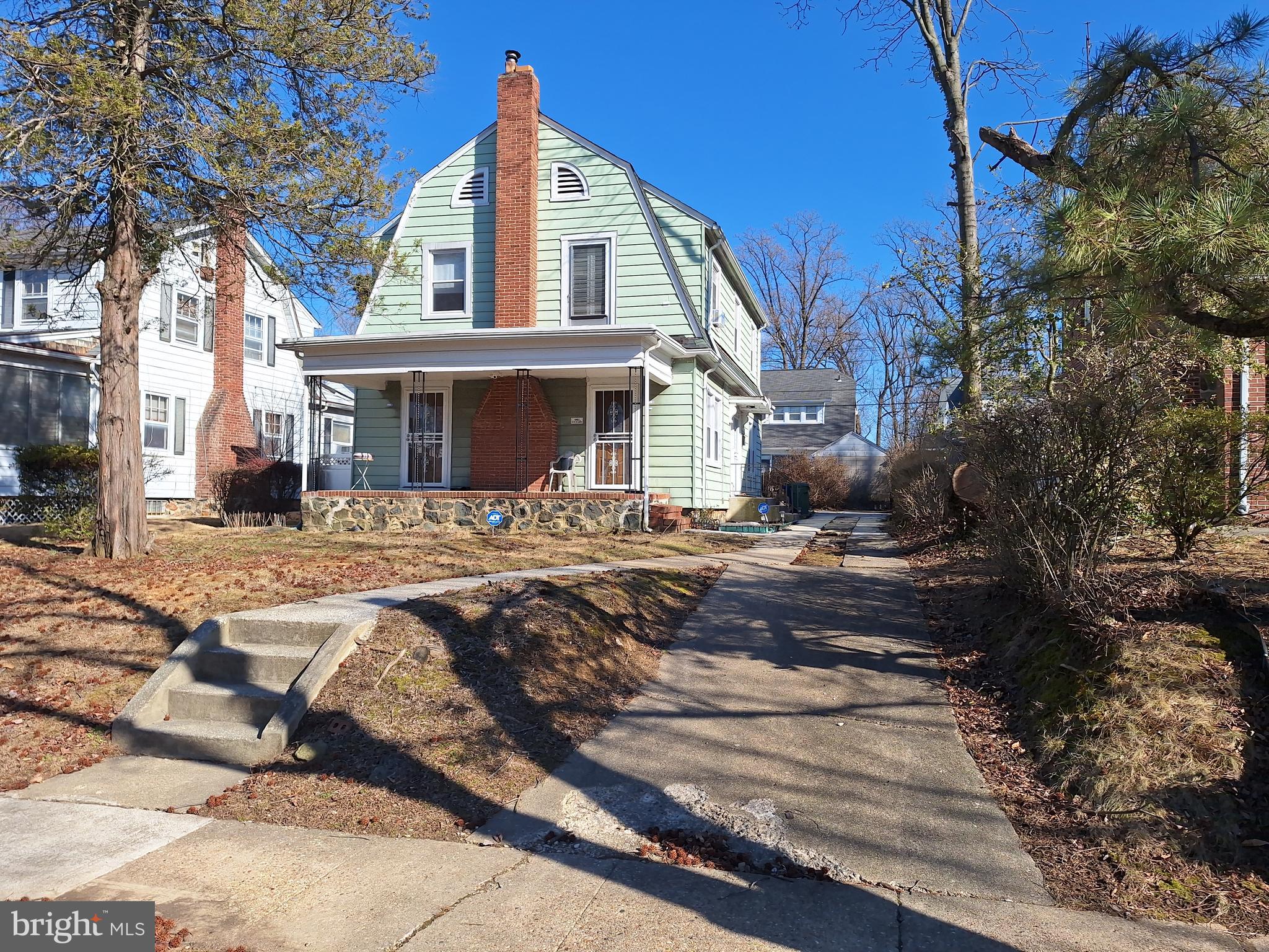 3803 Cedardale Road Baltimore, MD 21215 - Photo 4 of 56 a front view of a house with a yard