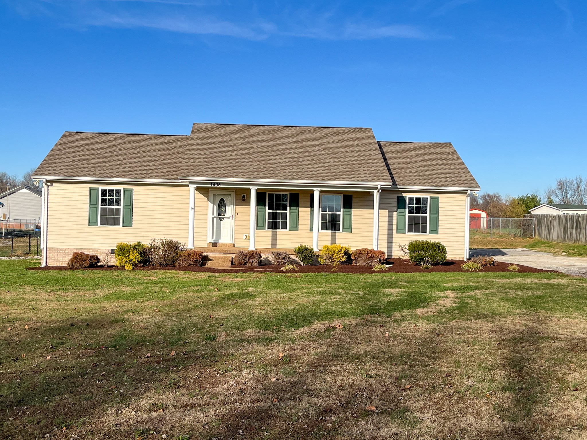 1905 Highway 259 Portland, TN 37148 - Photo 1 of 20 a front view of a house with a garden