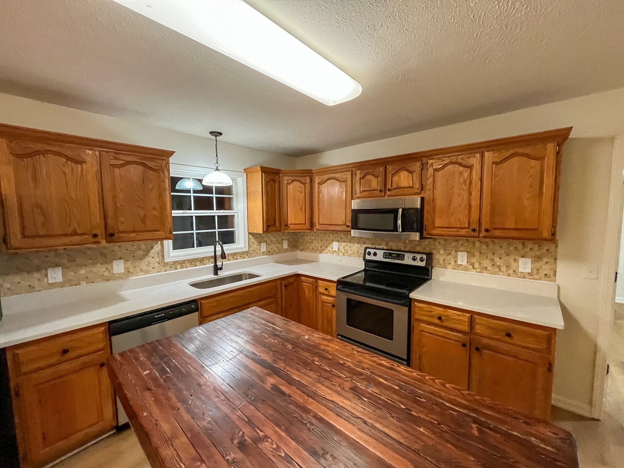 1905 Highway 259 Portland, TN 37148 - Photo 11 of 20 a kitchen with stainless steel appliances granite countertop a stove sink and cabinets