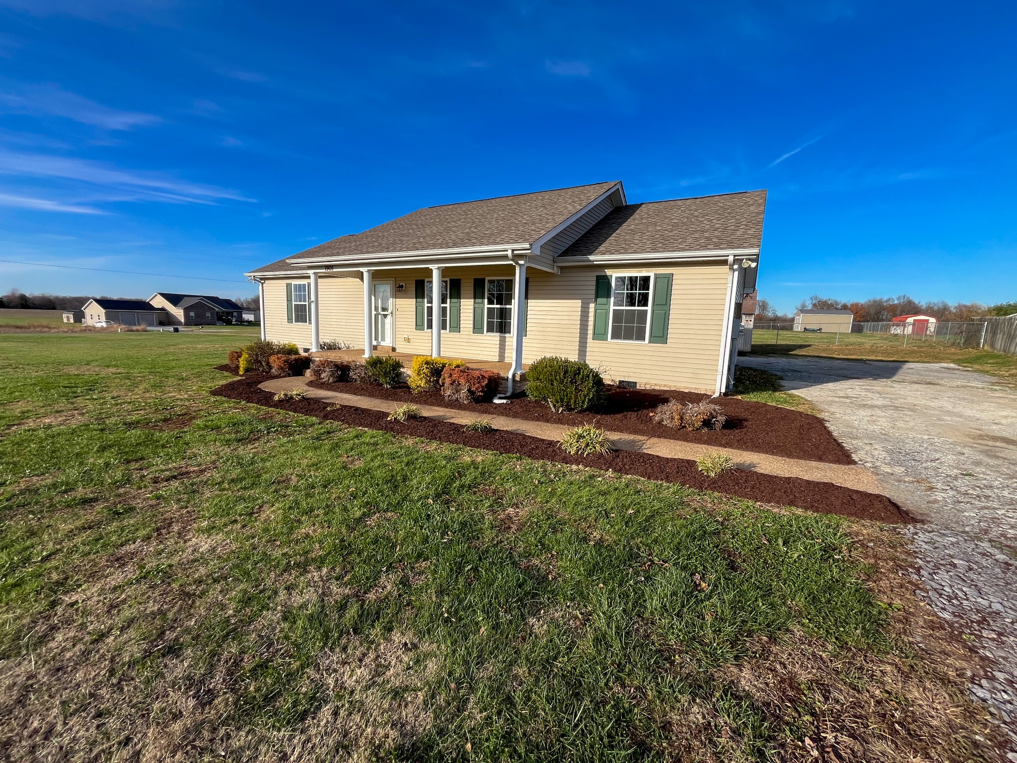1905 Highway 259 Portland, TN 37148 - Photo 2 of 20 a front view of a house with a yard table and chairs