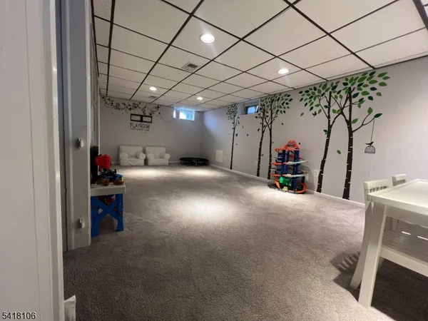 a view of a livingroom with furniture and a garage