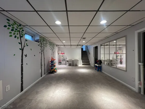a view of a livingroom with hardwood and furniture
