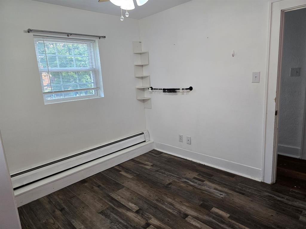 1008 Manor Road New Kensington, PA 15068 - Photo 29 of 39 a view of an empty room with wooden floor and a window
