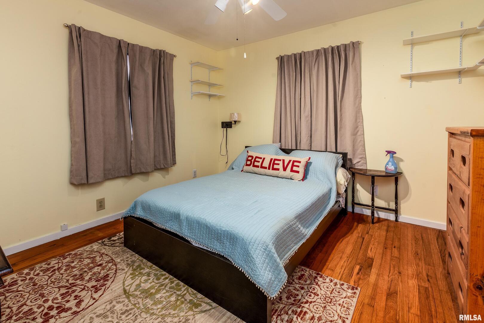 2320 McCord Street Murphysboro, IL 62966 - Photo 15 of 27 a bedroom with a bed and a dresser