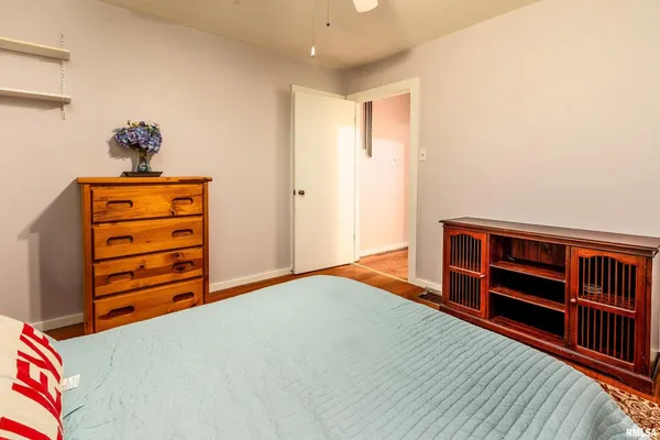 a bedroom with a bed and closet