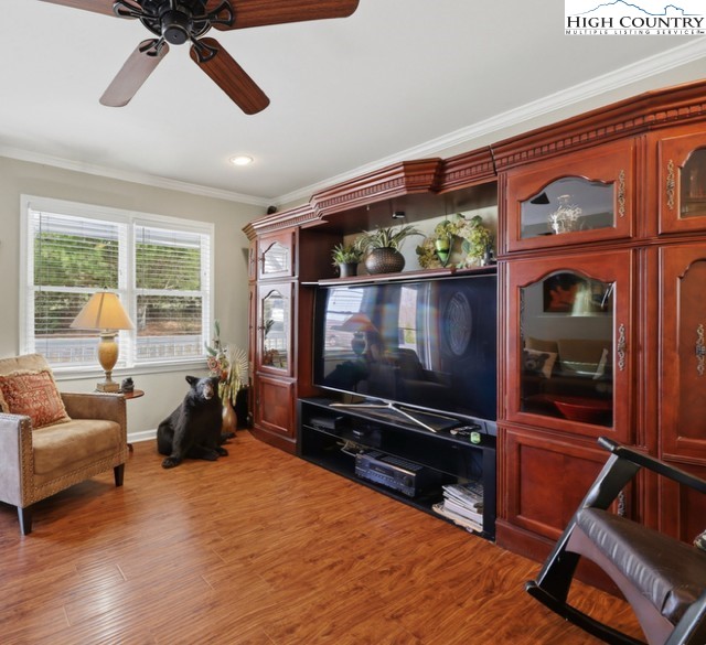 154 Beau Rivage Drive Crumpler, NC 28617 - Photo 12 of 34 a living room with furniture flat screen tv and a large window