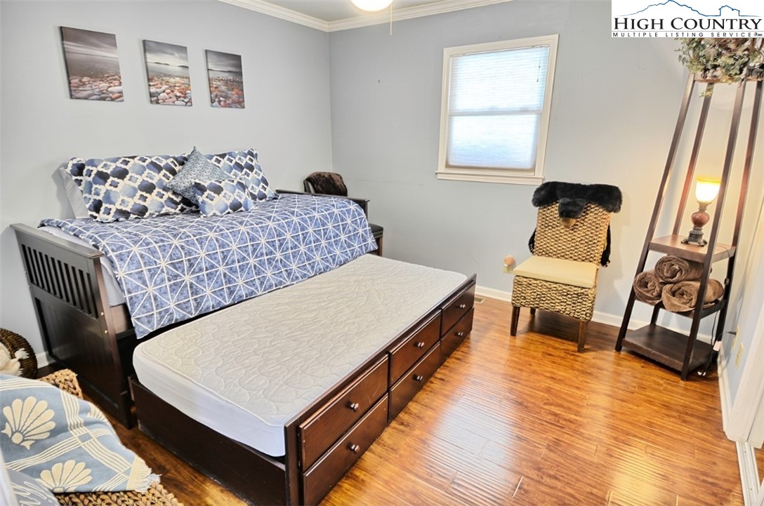 154 Beau Rivage Drive Crumpler, NC 28617 - Photo 18 of 34 a living room with furniture and a wooden floor