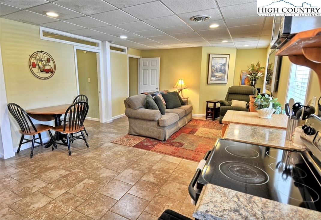 154 Beau Rivage Drive Crumpler, NC 28617 - Photo 21 of 34 a living room with furniture and a large window