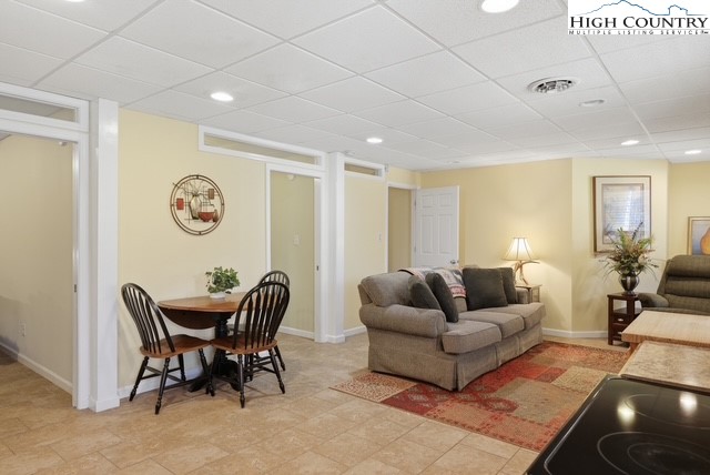 154 Beau Rivage Drive Crumpler, NC 28617 - Photo 25 of 34 a living room with furniture and wooden floor