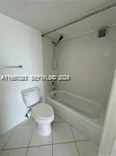 a bathroom with a toilet a sink and bathtub