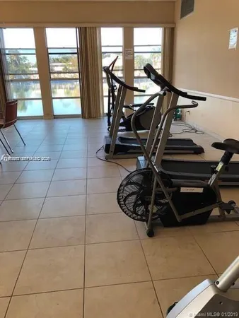 a kitchen with stainless steel appliances granite countertop a refrigerator sink and cabinets