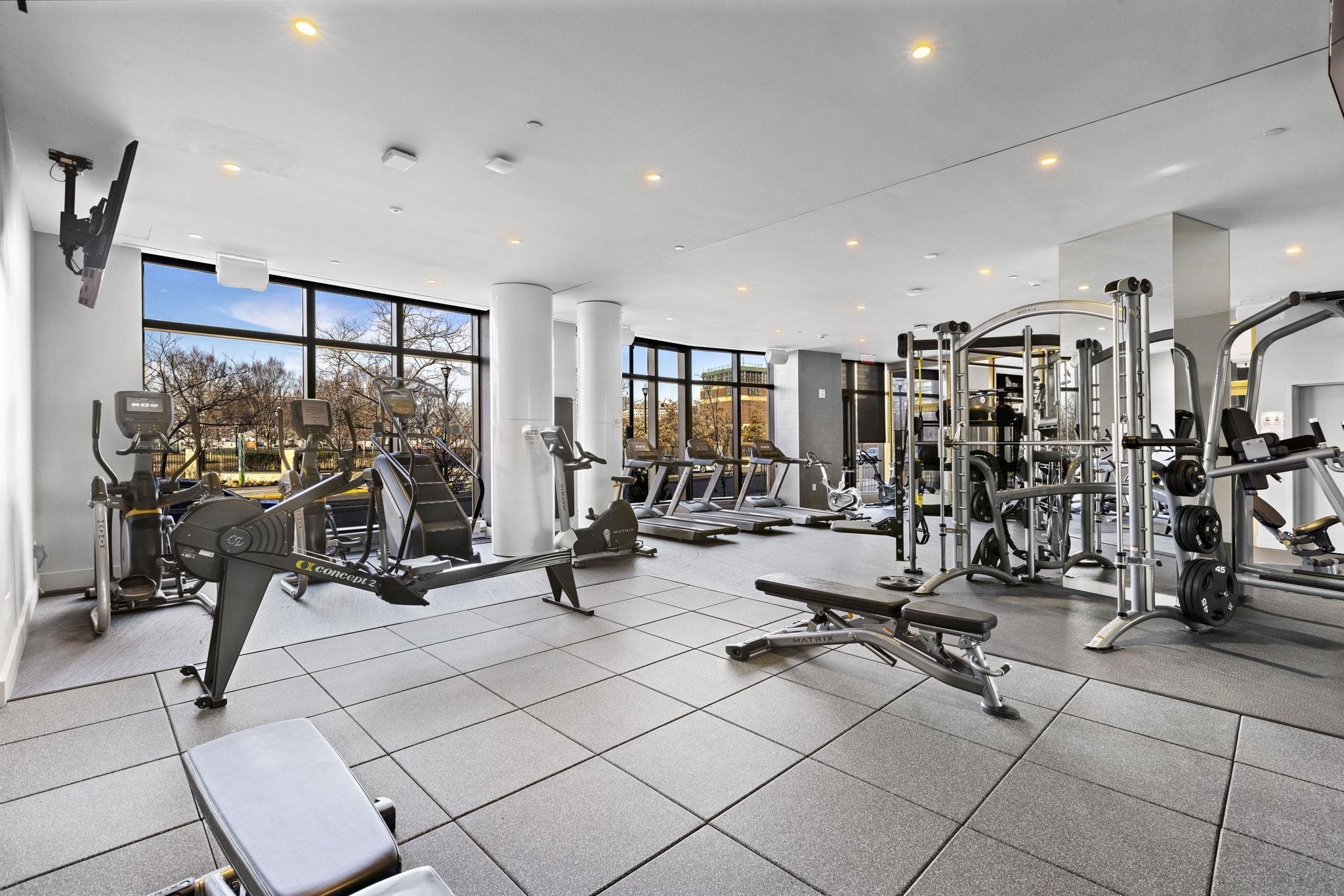 75 Park Lane South, Unit 1607 Jersey City, NJ 07310 - Photo 19 of 20 a view of a room with gym equipment