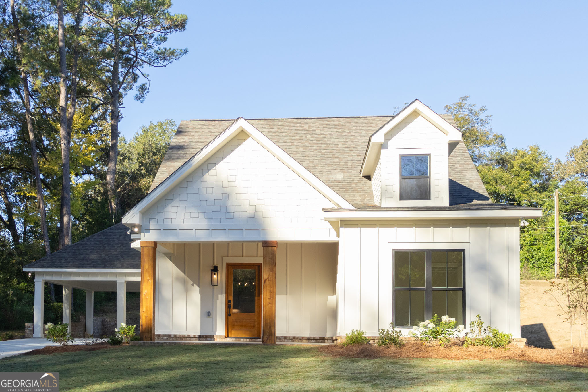 a front view of a house with garden