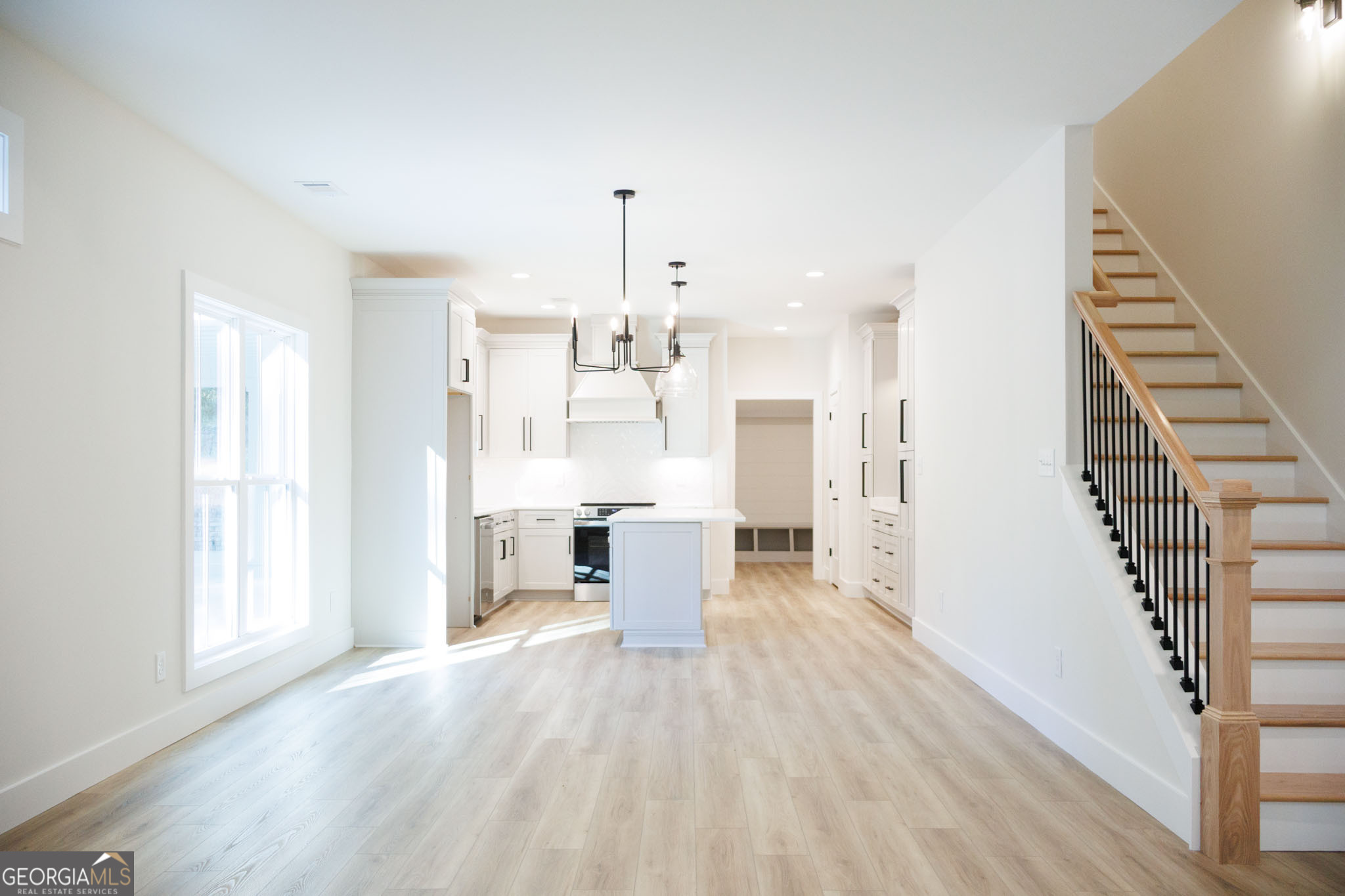 903 Massee Lane Perry, GA 31069 - Photo 11 of 26 a view of a kitchen with wooden floor and electronic appliances