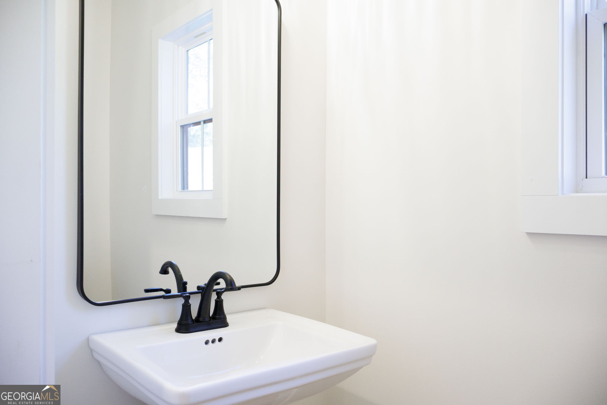 903 Massee Lane Perry, GA 31069 - Photo 17 of 26 a bathroom with a sink and mirror