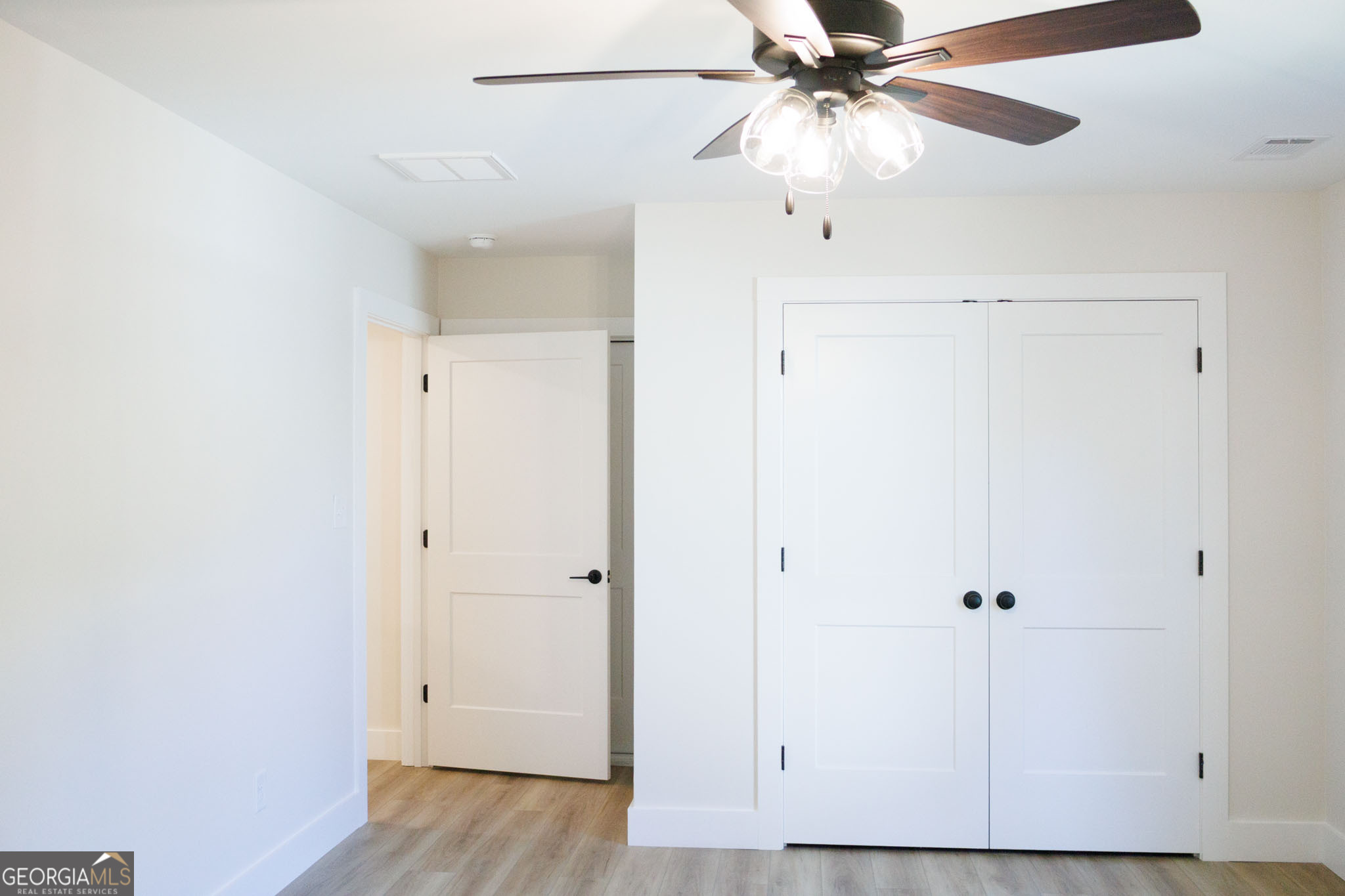 903 Massee Lane Perry, GA 31069 - Photo 20 of 26 a view of a hallway with a ceiling fan
