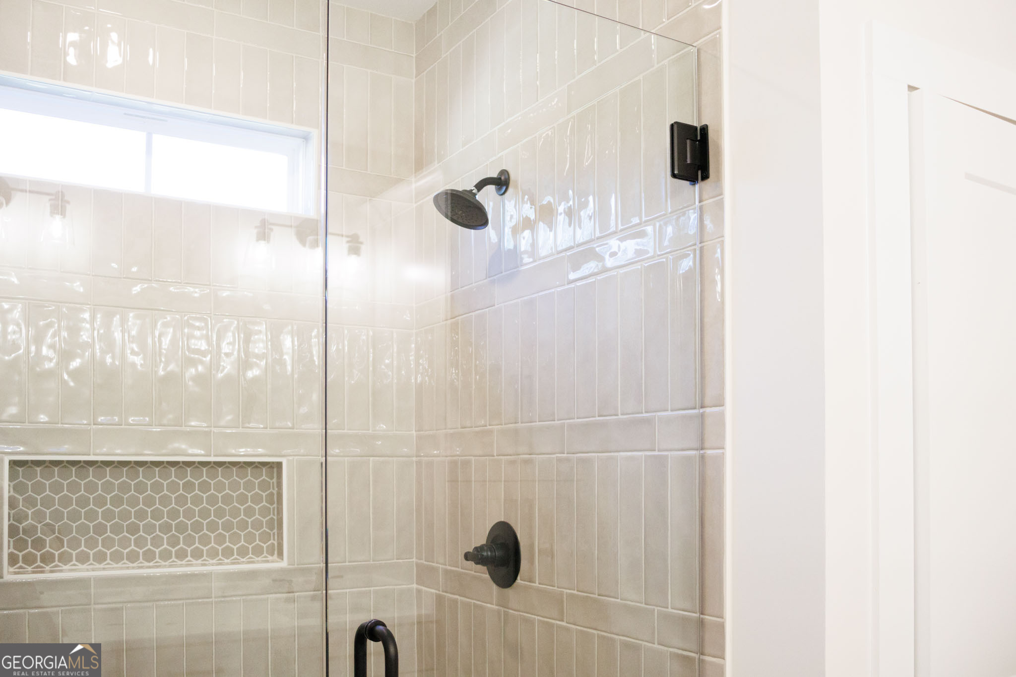 903 Massee Lane Perry, GA 31069 - Photo 24 of 26 a bathroom with a shower