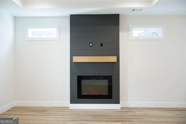 a view of a livingroom with wooden floor