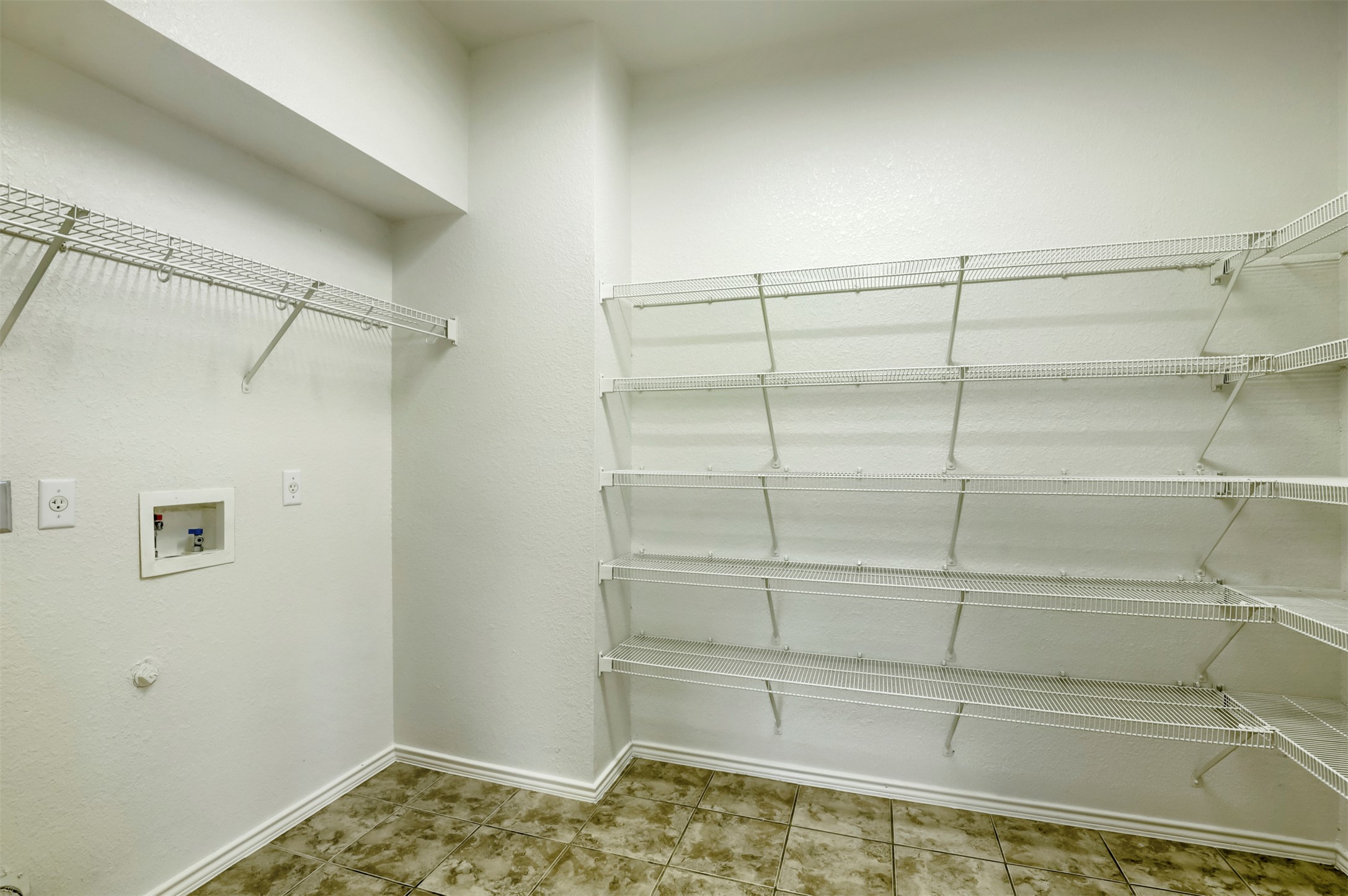4125 Pebble Ridge Cove Round Rock, TX 78681 - Photo 12 of 30 Ample wire shelving provides generous storage in this functional utility space.