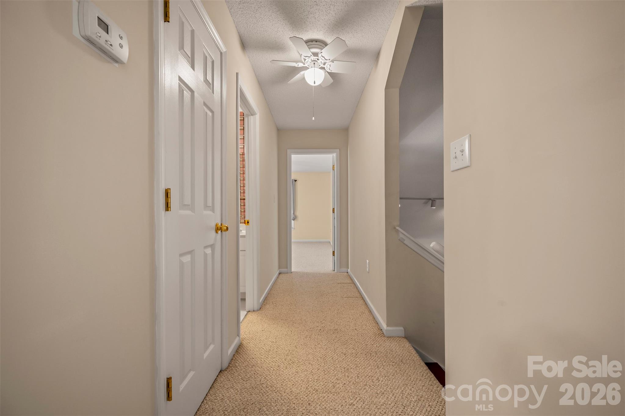 506 Pleasant Street Spindale, NC 28160 - Photo 21 of 42 a view of a hallway with a chandelier fan