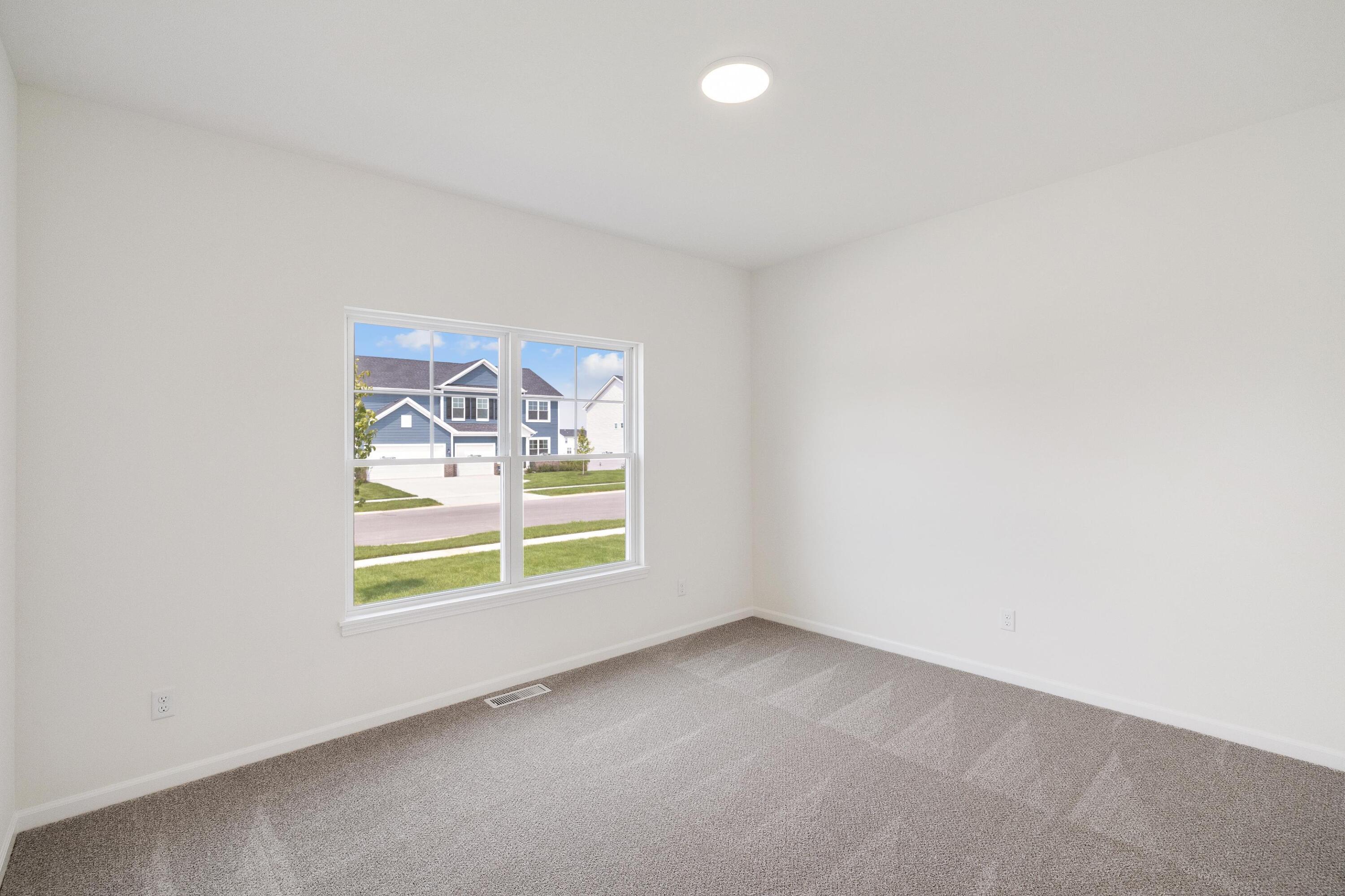 6821 Tucson Road Schererville, IN 46375 - Photo 5 of 24 an empty room with windows