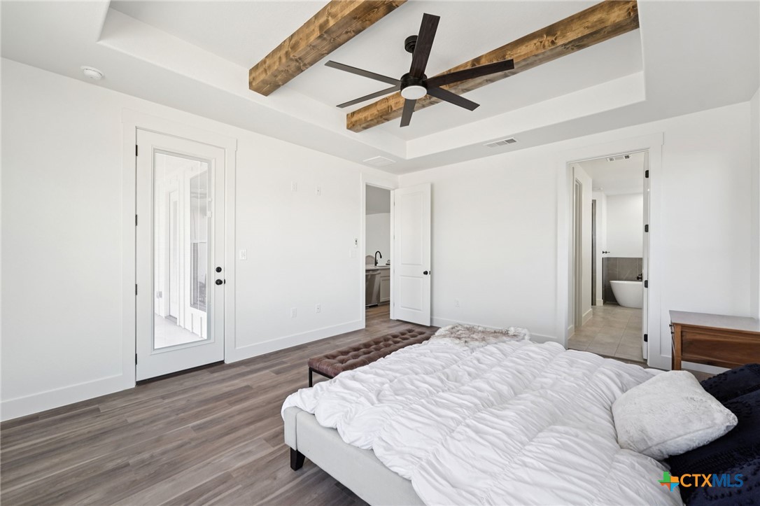 5207 Hollow Ranch Drive Salado, TX 76571 - Photo 21 of 37 a bedroom with a bed and a ceiling fan