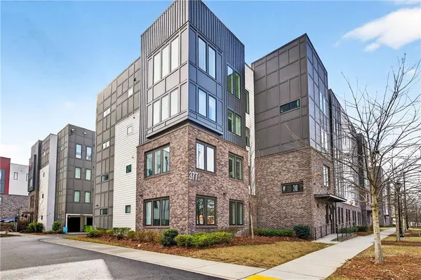 a view of a building next to a street