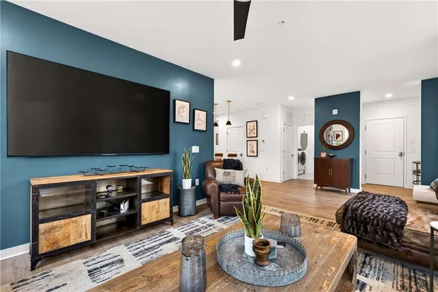 a living room with furniture and a flat screen tv