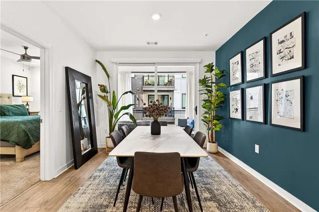a view of a dining room with furniture window and wooden floor