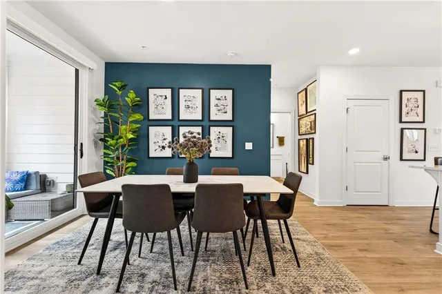 a view of a dining room with furniture window and wooden floor