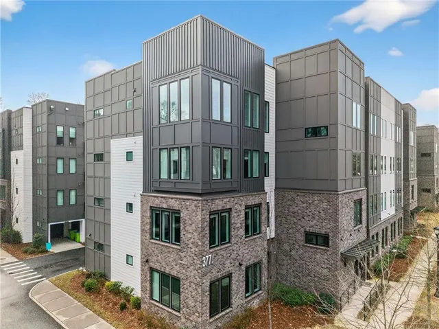 a front view of a building with glass windows