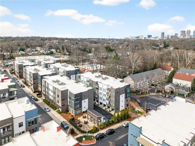 a view of multiple houses with a yard