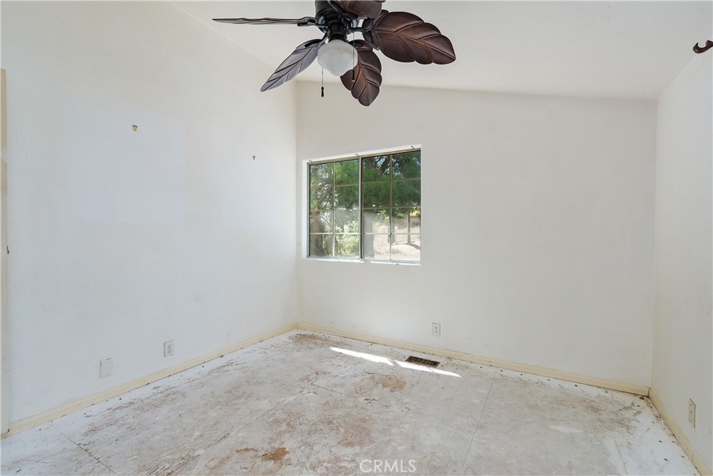 34881 Los Nogales Road Temecula, CA 92592 - Photo 36 of 50 Bedroom 3 needs flooring and paint. It has a Ceiling fan & mirrored closet doors.